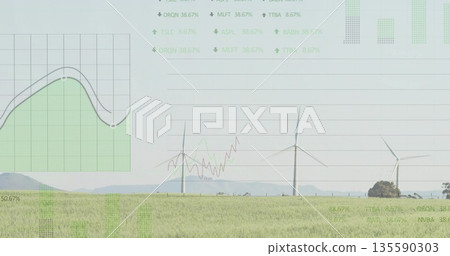 Wind farm featuring three rotating turbines in field by hills, with translucent data overlays 135590303