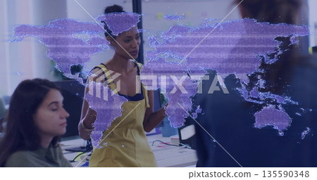 Leading discussion woman in yellow overalls holding notebooks in workspace, with purple map graphic 135590348