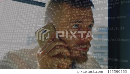 Talking on gold phone, engineer in checkered shirt gazing out office window, with network overlay Talking on gold phone, engineer in checkered shirt gazing out office window, with network overlay 135590363
