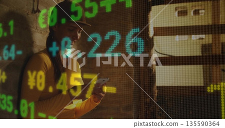 Woman in baseball cap checking stock trends on smartphone in cellar with overlays, copy space Woman in baseball cap checking stock trends on smartphone in cellar with overlays, copy space 135590364