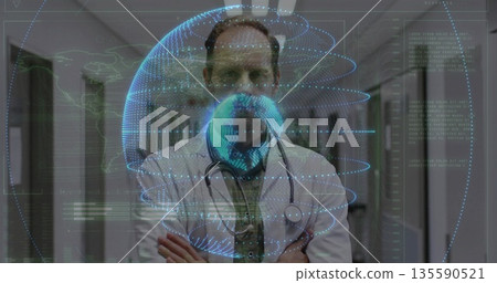Displaying holographic globe, doctor in lab coat and stethoscope standing in hospital corridor Displaying holographic globe, doctor in lab coat and stethoscope standing in hospital corridor 135590521