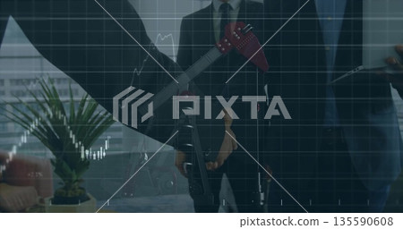Professionals wearing suits discussing energy market in office, pump jack model and laptop Professionals wearing suits discussing energy market in office, pump jack model and laptop 135590608