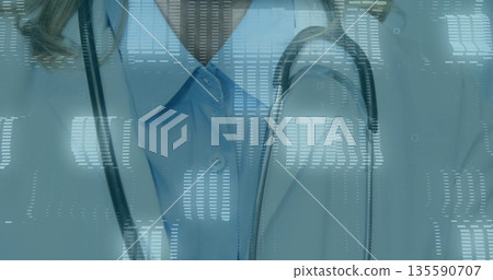 Female physician wearing lab coat monitoring waveform and grid overlays in clinic, with stethoscope 135590707