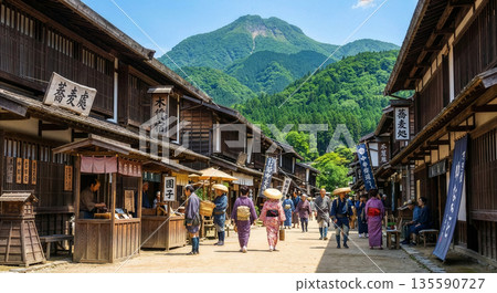 Travelers passing through Tsumago-juku on the Nakasendo road, a bustling area during the Edo period, and the scenery of a post town with a historical atmosphere 135590727