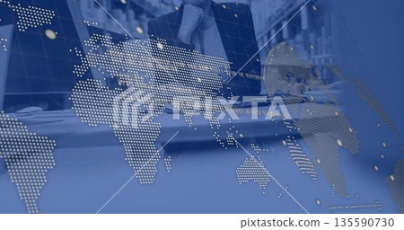 Adjusting mature businesswoman tying neck scarf behind desk at control center, map overlay Adjusting mature businesswoman tying neck scarf behind desk at control center, map overlay 135590730