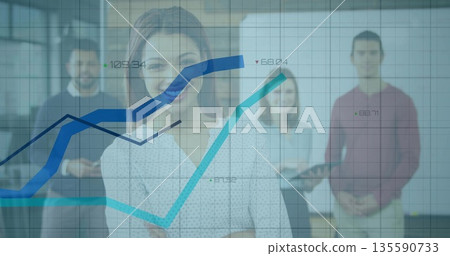 Standing woman in blouse presenting line charts in glass office with digital display and tablet Standing woman in blouse presenting line charts in glass office with digital display and tablet 135590733