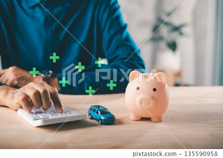Car auto loan money saving with piggy bank, insurance for tax safety, person calculates debt management, ensuring financial growth with smart future planning and wise decisions Car auto loan money saving with piggy bank, insurance for tax safety, person calculates debt management, ensuring financial growth with smart future planning and wise decisions 135590958