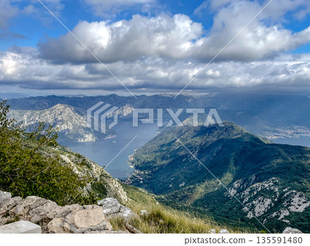 Experience the breathtaking and stunning mountain view that overlooks a serene and picturesque bay Experience the breathtaking and stunning mountain view that overlooks a serene and picturesque bay 135591480