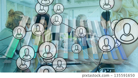 Meeting team of professionals discussing data analysis in conference room, with tablet and overlays 135591650