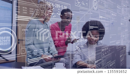 Working three women in blazers analyzing data on monitors and tablet at office desk, with overlays Working three women in blazers analyzing data on monitors and tablet at office desk, with overlays 135591652