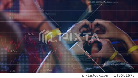Raising yellow-wristbanded hands, forming heart-shapes toward stage under lights, with data charts Raising yellow-wristbanded hands, forming heart-shapes toward stage under lights, with data charts 135591673