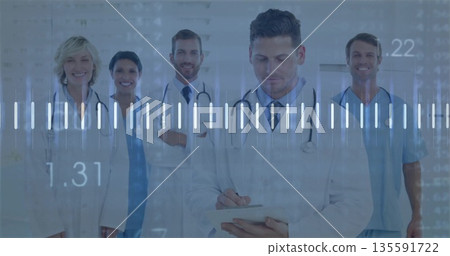 Writing physician documenting info on tablet in hospital corridor, with digital waveform overlay Writing physician documenting info on tablet in hospital corridor, with digital waveform overlay 135591722