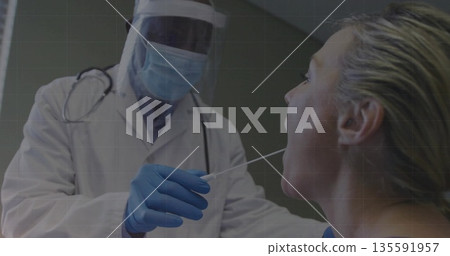 Medical worker collecting throat swab in clinical testing room, with face shield and swab stick 135591957
