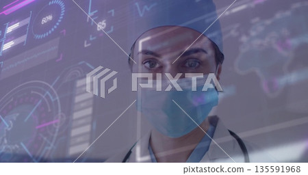 Analyzing doctor in scrubs surgical cap and mask examining interface in clinic with stethoscope Analyzing doctor in scrubs surgical cap and mask examining interface in clinic with stethoscope 135591968
