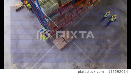 Workers in vests, hard hats inspecting stock in warehouse, with shelving rack, pallets, copy space 135592014