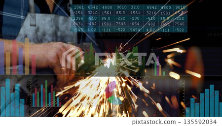 Grinding hands wearing apron gripping angle grinder producing sparks in workshop with data overlays Grinding hands wearing apron gripping angle grinder producing sparks in workshop with data overlays 135592034