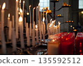 Burning Candles in Church Illuminate the Sacred Space 135592512