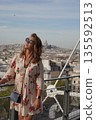 Stylish Woman Enjoying Paris Skyline View 135592513
