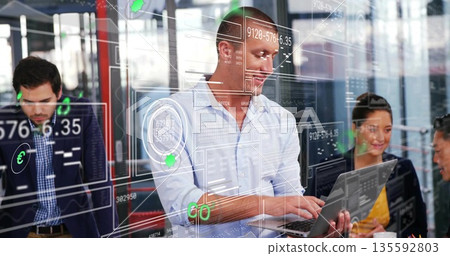 Collaborating data analysts wearing business attire typing on laptop and discussing data at office Collaborating data analysts wearing business attire typing on laptop and discussing data at office 135592803