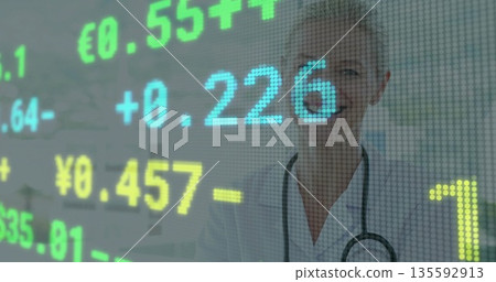 Analyzing doctor in lab coat and stethoscope viewing digital currency rates in clinic, copy space Analyzing doctor in lab coat and stethoscope viewing digital currency rates in clinic, copy space 135592913