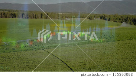 Displaying center pivot irrigation machine watering green crop rows in farmland, with data overlay Displaying center pivot irrigation machine watering green crop rows in farmland, with data overlay 135593098