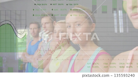 Posing five participants crossing arms and looking at camera in fitness studio with data overlay 135593240