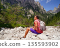 Man Relaxing on a Rocky Mountain Hike 135593902