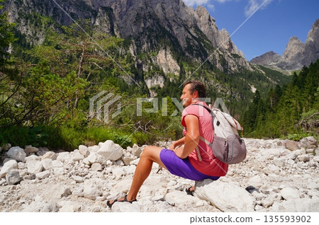 Man Relaxing on a Rocky Mountain Hike 135593902