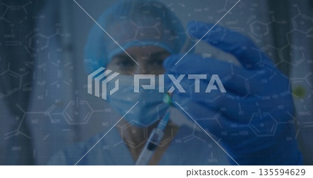 Holding medical researcher wearing scrubs mask gloves preparing syringe in lab, molecular overlay Holding medical researcher wearing scrubs mask gloves preparing syringe in lab, molecular overlay 135594629
