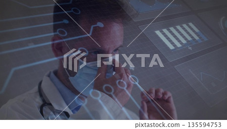 Adjusting doctor fitting blue mask in clinic, with stethoscope and interface charts, copy space 135594753