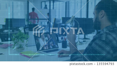 Joining bearded man attending conference call on laptop in open-plan office, copy space 135594793