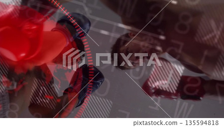Boxing sparring partners wearing sleeveless tops and gloves in boxing gym, with digital HUD overlay Boxing sparring partners wearing sleeveless tops and gloves in boxing gym, with digital HUD overlay 135594818