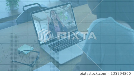 Man joining coworker gesturing on laptop in home office, typing amid eyeglasses and sticky note pad Man joining coworker gesturing on laptop in home office, typing amid eyeglasses and sticky note pad 135594860