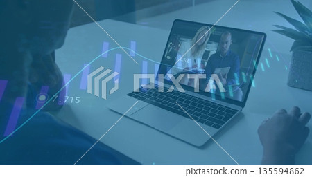 Joining online meeting on laptop showing two coworkers with succulent, financial charts in office Joining online meeting on laptop showing two coworkers with succulent, financial charts in office 135594862