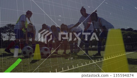 Lining seven female soccer players in bibs on grass field, showing cones balls and data overlay Lining seven female soccer players in bibs on grass field, showing cones balls and data overlay 135594874