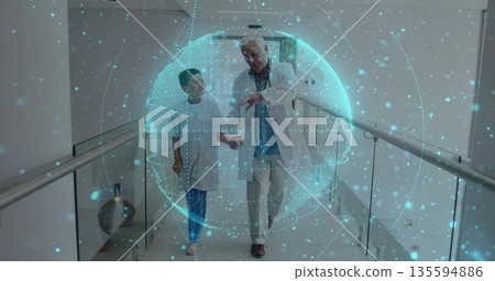 Walking doctor with stethoscope and boy in gown through hospital corridor under digital hologram Walking doctor with stethoscope and boy in gown through hospital corridor under digital hologram 135594886