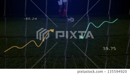 Displaying analytics overlay on pitch and net at night, with soccer ball and white-uniform player Displaying analytics overlay on pitch and net at night, with soccer ball and white-uniform player 135594920