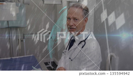 Standing doctor wearing lab coat viewing digital overlay in exam room, with stethoscope, copy space Standing doctor wearing lab coat viewing digital overlay in exam room, with stethoscope, copy space 135594942