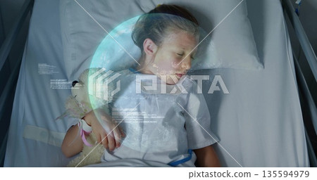 Sleeping child in hospital gown, clutching pink ribbon teddy bear amid earth hologram and data text Sleeping child in hospital gown, clutching pink ribbon teddy bear amid earth hologram and data text 135594979