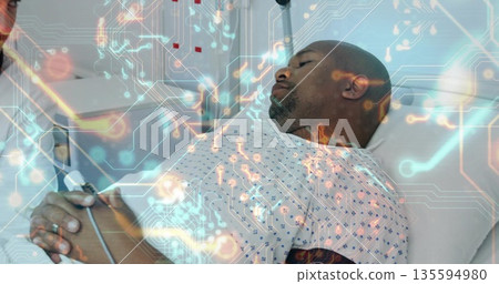 Lying male patient wearing printed gown in hospital bed, with digital circuit overlay, copy space Lying male patient wearing printed gown in hospital bed, with digital circuit overlay, copy space 135594980