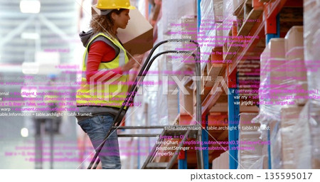Worker climbing stepladder in hardhat safetyvest retrieving box in storage rack aisle, copy space 135595017
