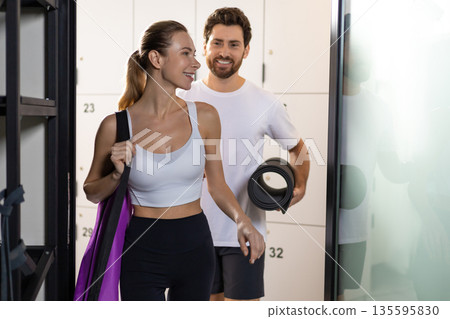 Two people in a gym before workout feeling excited 135595830
