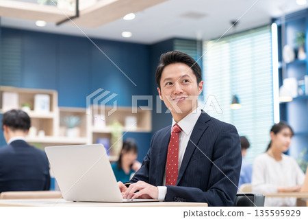 Middle-aged businessman working in the office 135595929