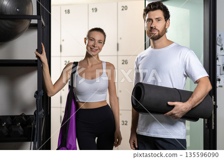 Two people in a gym before workout feeling excited Two people in a gym before workout feeling excited 135596090
