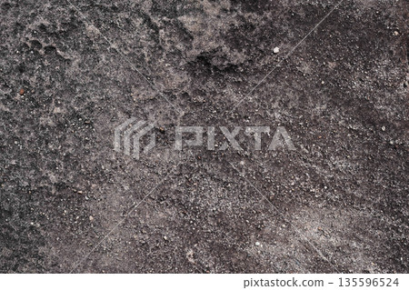 Dark rock terrain with visible gravel Dark rock terrain with visible gravel 135596524