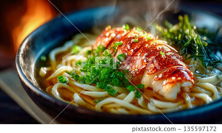 Gourmet bowl of udon noodles topped with lobster meat, green onions, and sesame in rich broth 135597172