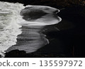 Beautiful waves on a black sand beach 135597972