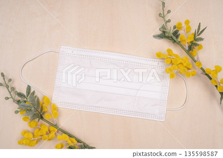 Mosaic flowers and disposable masks. Hay fever and allergy season background material. Mosaic flowers and disposable masks. Hay fever and allergy season background material. 135598587