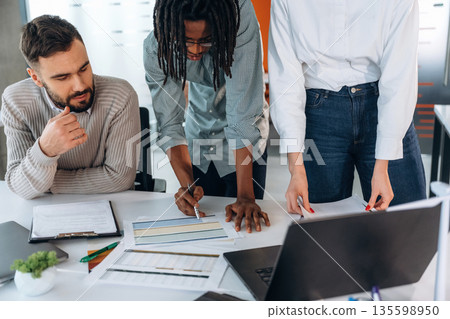 People are working in the office together People are working in the office together 135598950