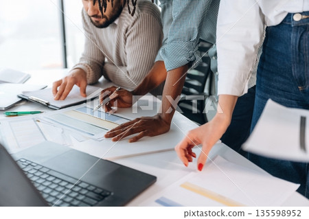 People are working in the office together People are working in the office together 135598952